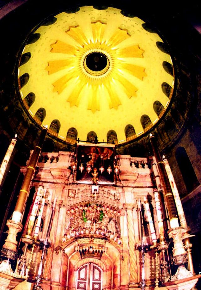Viewed from the floor 100 ft. below, the Great Cupola looms above the Church of the Holy Sepulcher. (photo courtesy Ara Normart) on scaffolding finish up as the newly completed ornament gleams